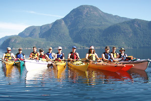 Photograph of a group of kayak students out on the water