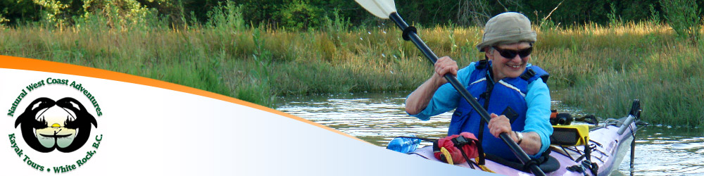 Photo of a smiling older woman taking a kayaking course
