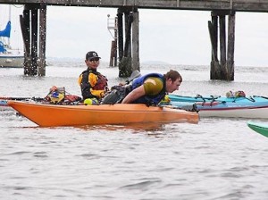Photo of a kayaking student learning to capsize his kayak