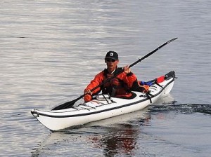 Photo of a kayak instructor floating in his kayak