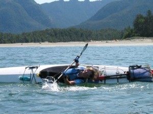 Photo of a kayak instructor demonstrating a proper kayak roll